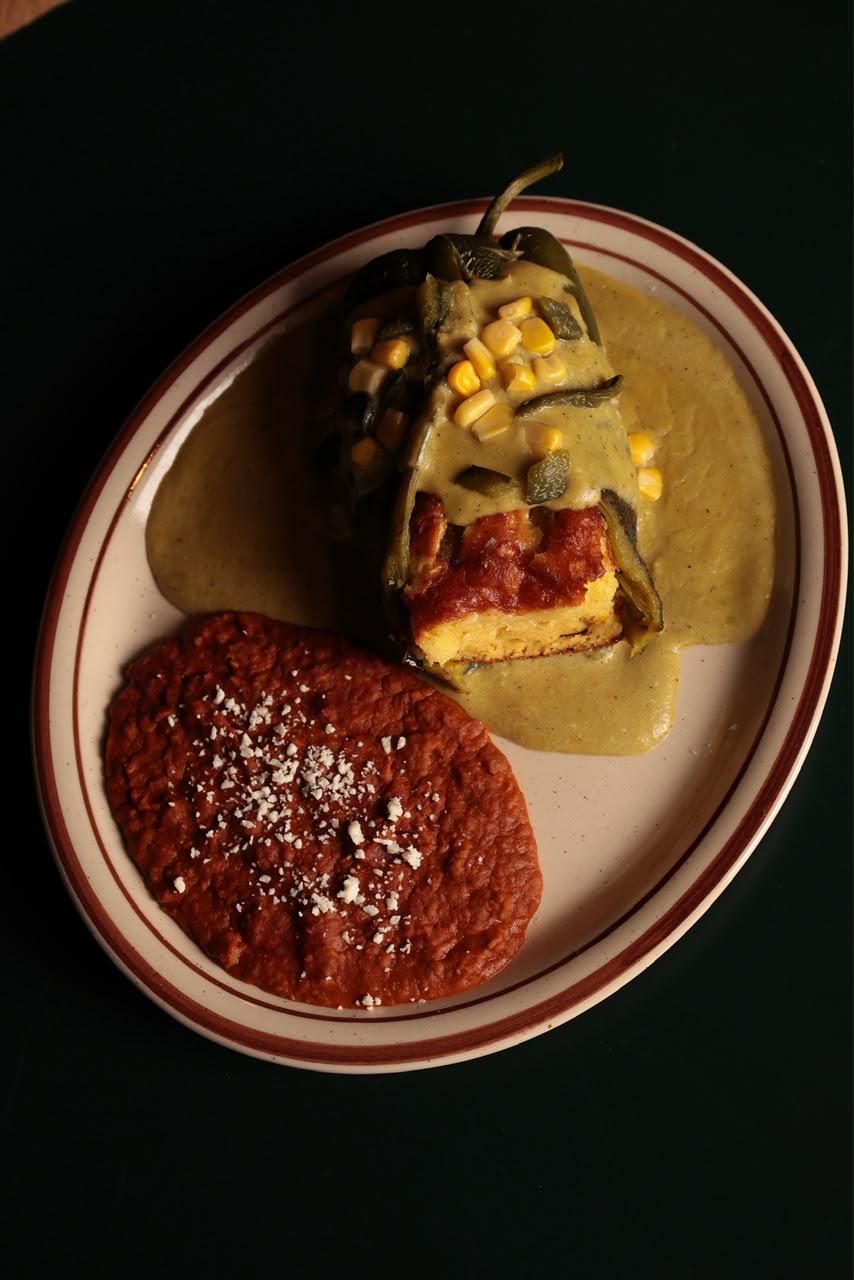 Chile relleno with corn cake and beans at Lomas